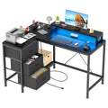 L-Shaped Gaming Desk - 7-Color LED Lights, 4 Power Outlets & 2 USB Ports, 3 Fabric Drawers, Removable Monitor Stand, Ergonomic
